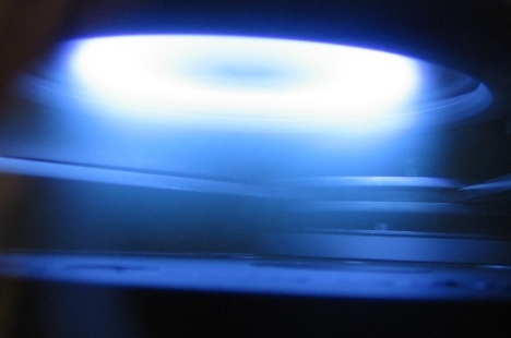 Plasma glow discharge in a magnetron sputter-505