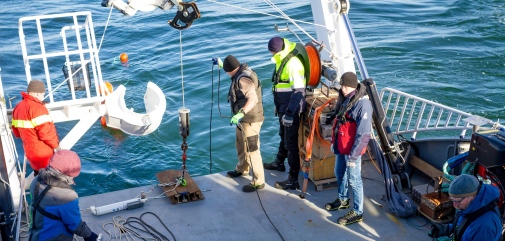 Researchers deploying instruments from R/V Electra for long-term measurements in the water.